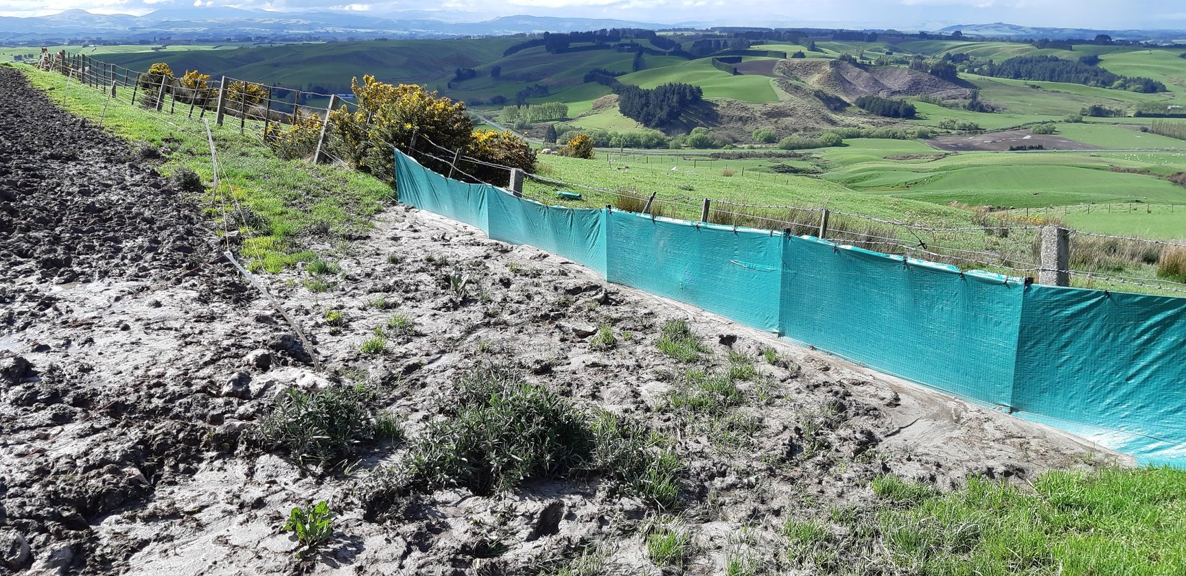 An 'after' shot of the fence showing it blocked over 20 wheelbarrow loads of mud from the finished crop above.