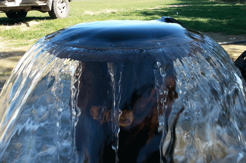 A mushroom-shaped fountain with flowing water.